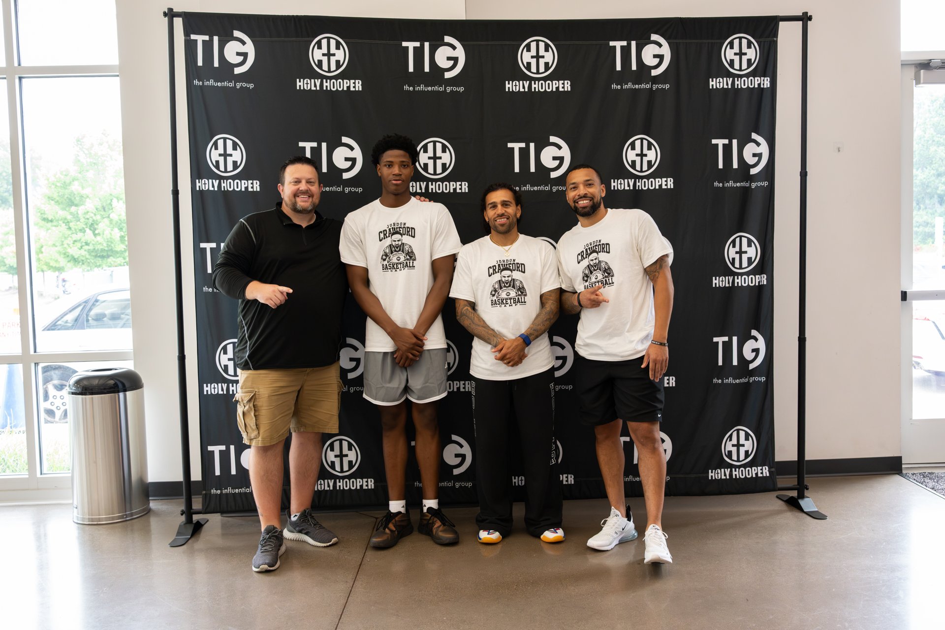 Camp participants and supporters in front of the Holy Hooper backdrop