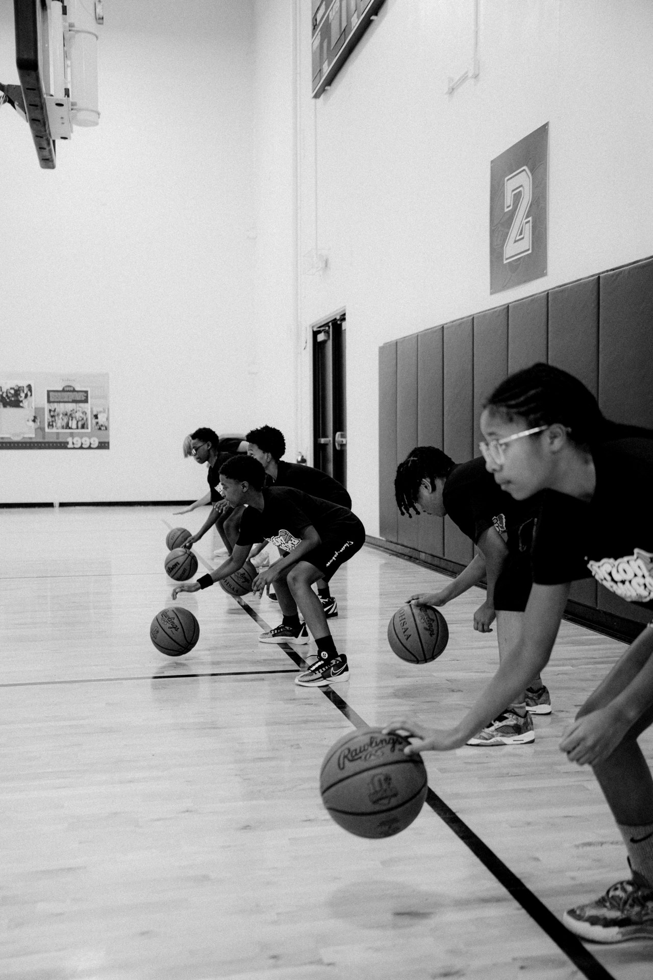 Young campers practicing basketball drills together at a Holy Hooper camp in Cincinnati